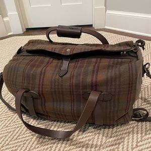 Like new, never used wool Filson duffel bag.